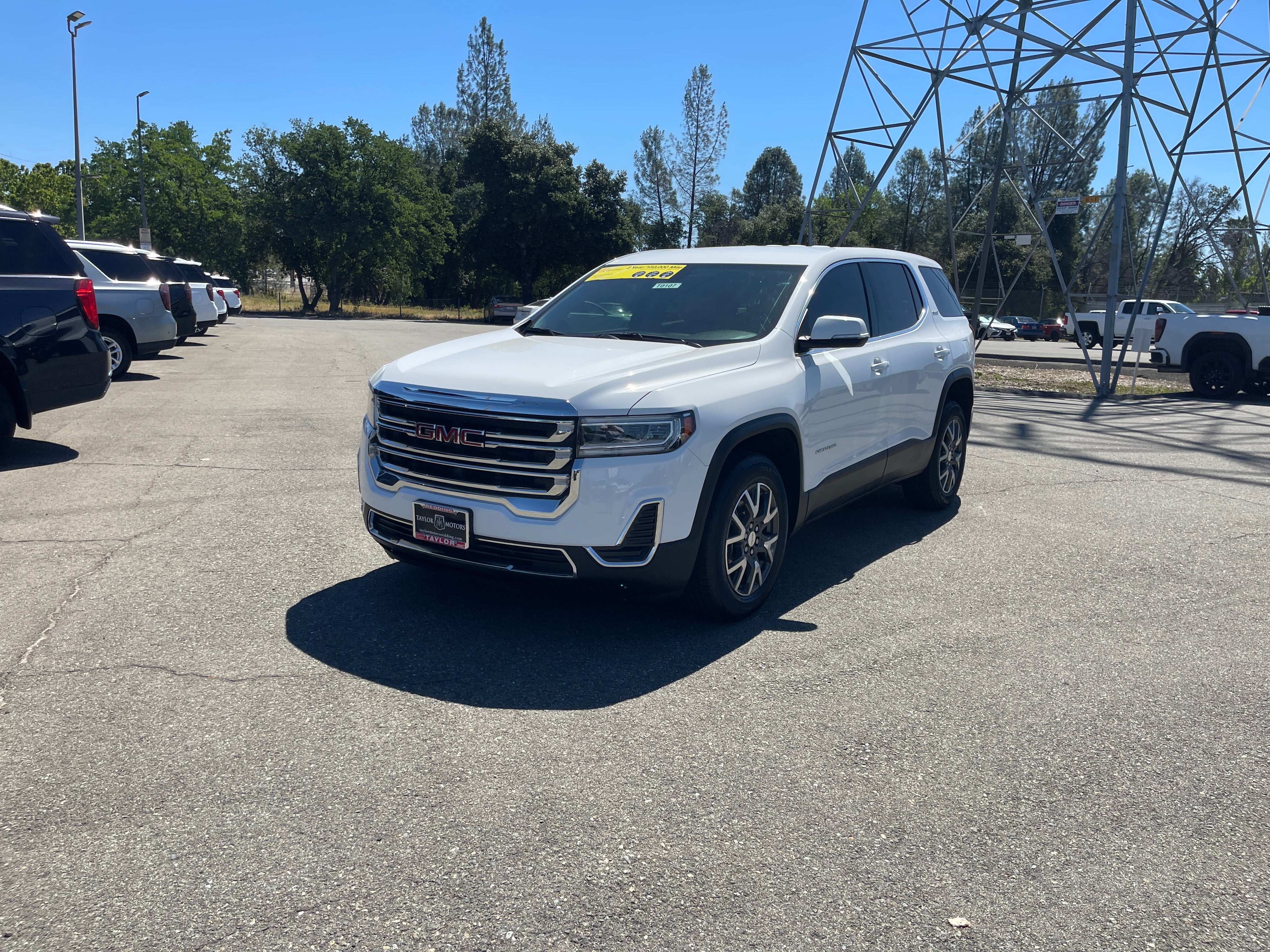 2021 GMC Acadia SLE in Summit White — front three-quarter view