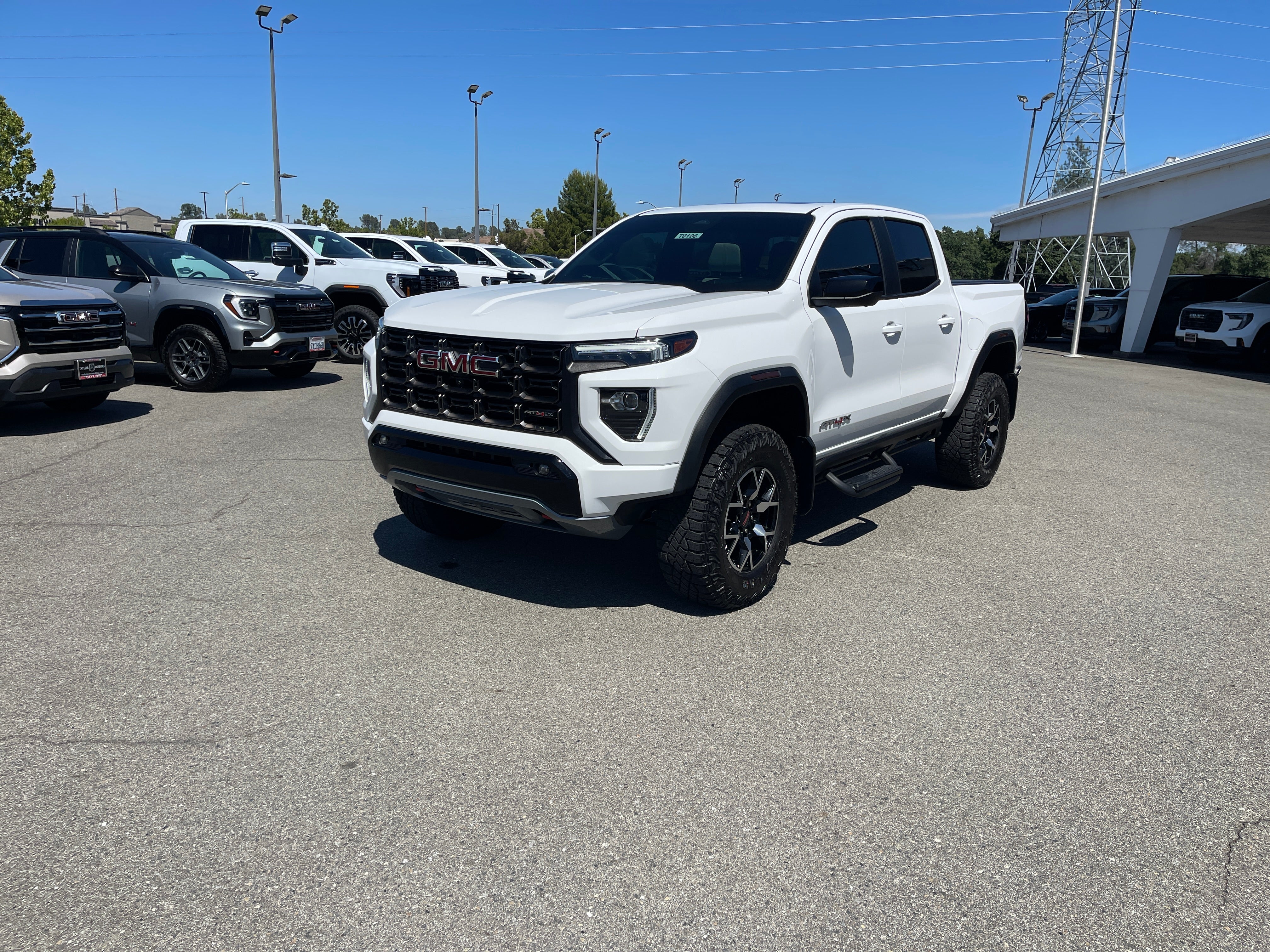 2024 GMC Canyon AT4X in Summit White — front three-quarter view